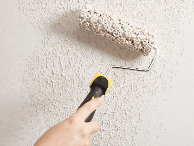 teture is being applied to a wall